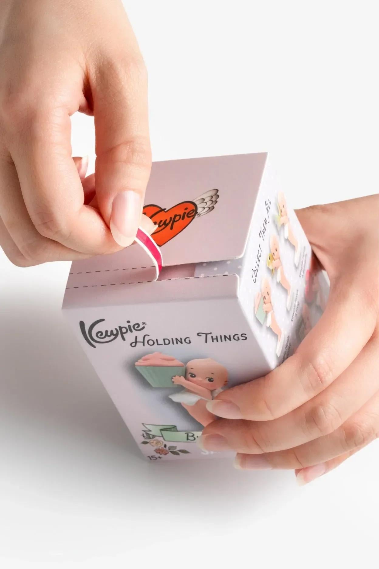 SMOKO Kewpie® Holding Things Blind Box